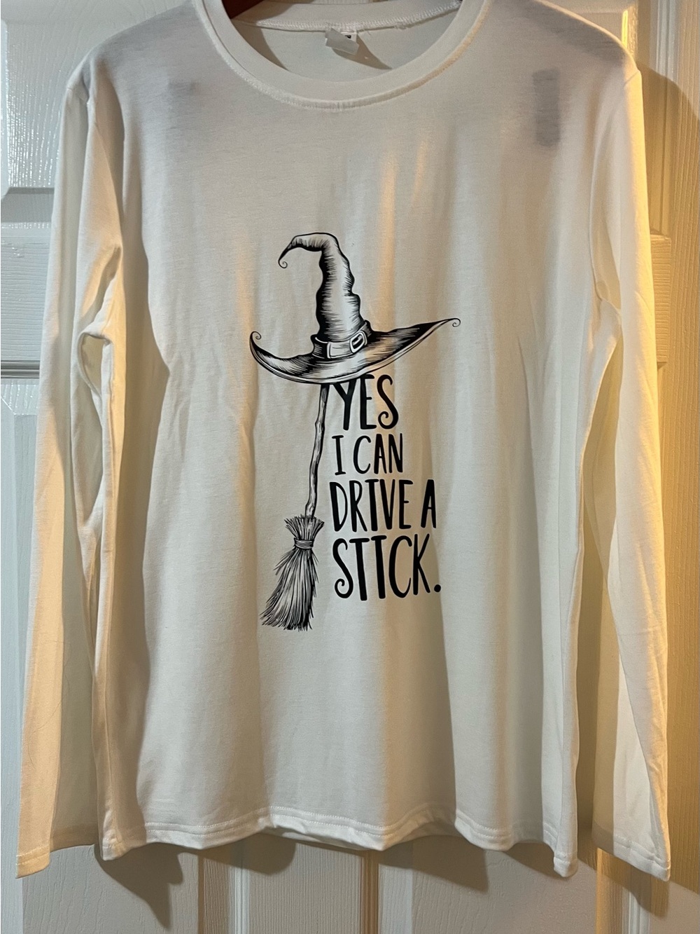 White Long-Sleeve Graphic Tee - Witch Hat & Broom NBC